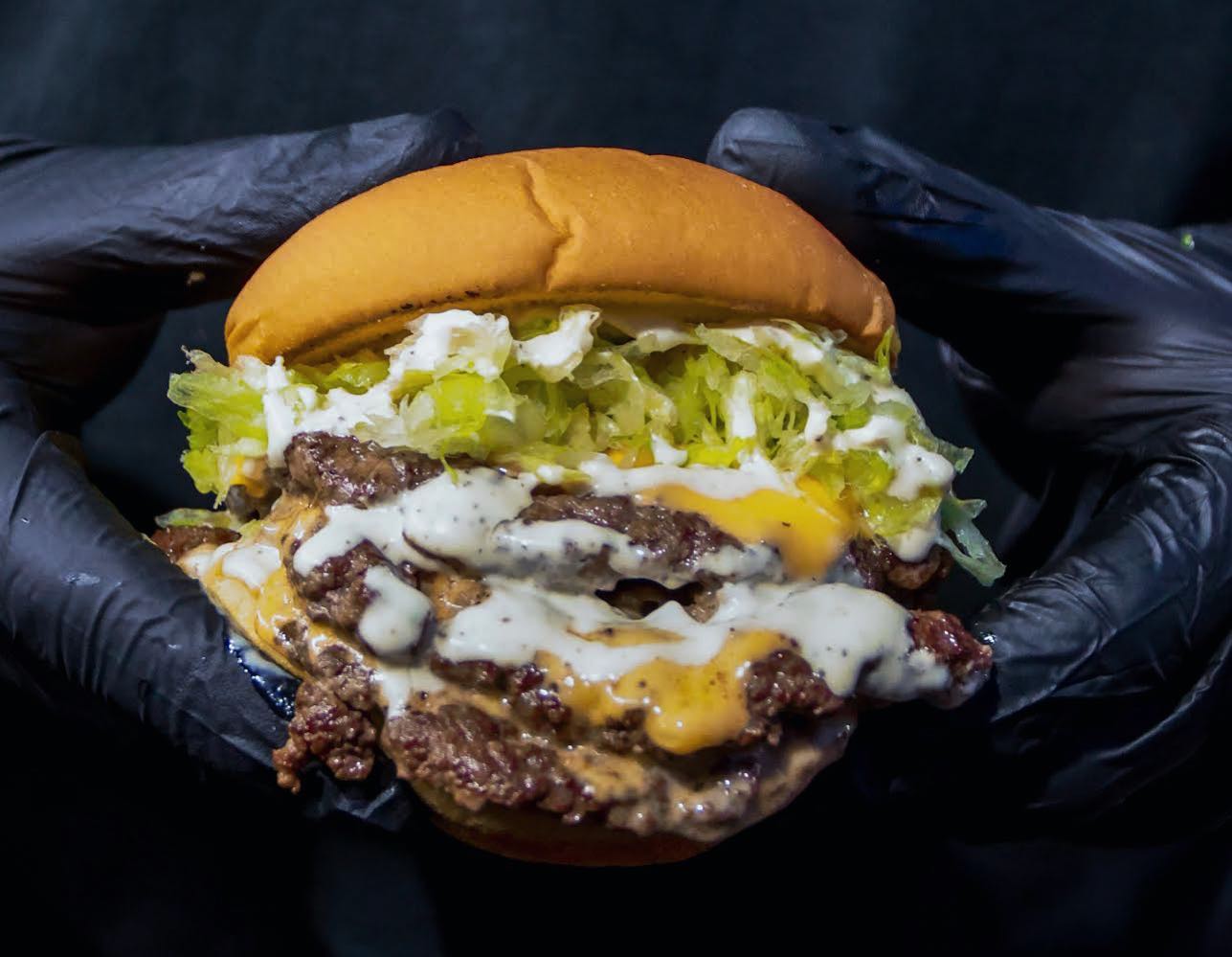 Double smash burger with shredded lettuce and house ranch